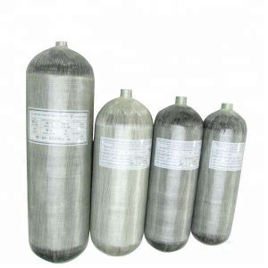 4 pc high pressure full-wrap cylinder in different sizes standing beside eachother. Grey coloured carbon then glass fiber wrapped